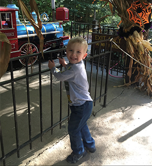 Boy looking at train.