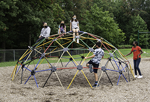 Children climbing on playground.