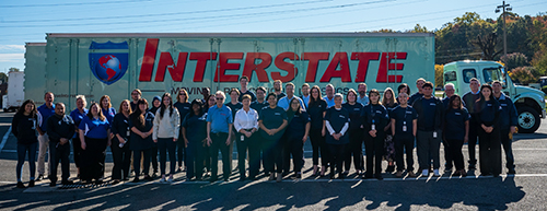Staff standing in front of an Interstate truck.