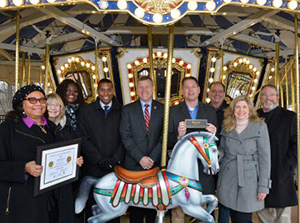 Transurban representatives with Fairfax County (VA) Government and Fairfax County (VA) Park Foundation Board members on carousel.