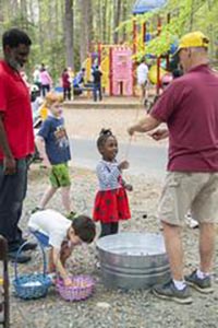 Girl learning to fish at Burke Lake event.