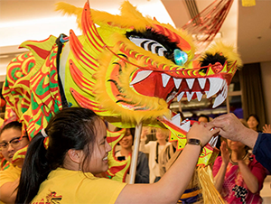 Lunar New Year with dragon puppet.