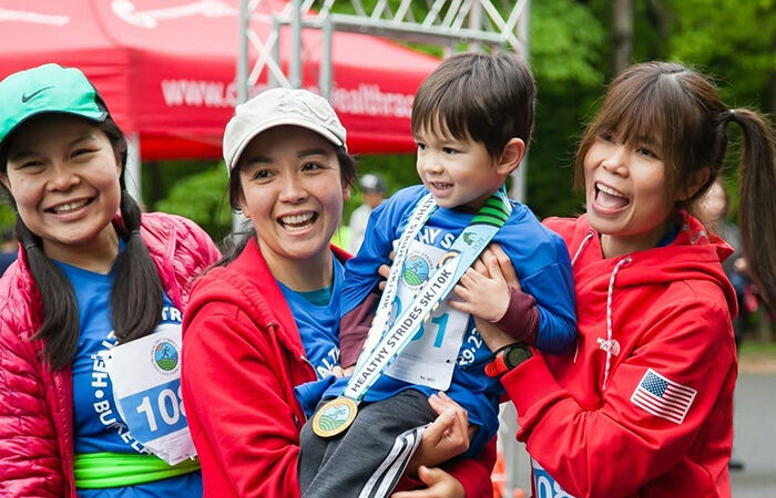 Four run racers and one with a Healthy Strides medal.