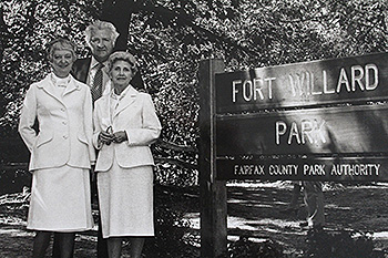 The Olmis stand beside the Fort Williard Park, Fairfax County (VA) Park Authority sign.